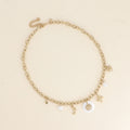 Collier - breloques (nacre, étoile, coeur, lune, soleil, perles d'eau douce)