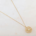Collier avec pendentif soleil et strass